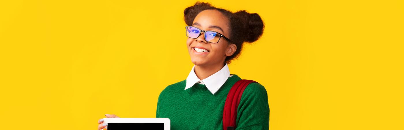 teen girl holding tablet