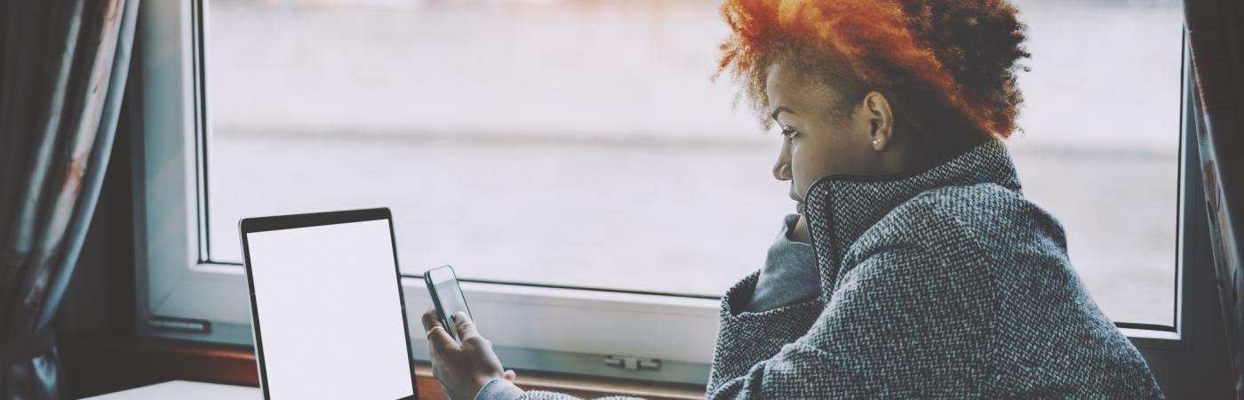 teen girl looking at laptop