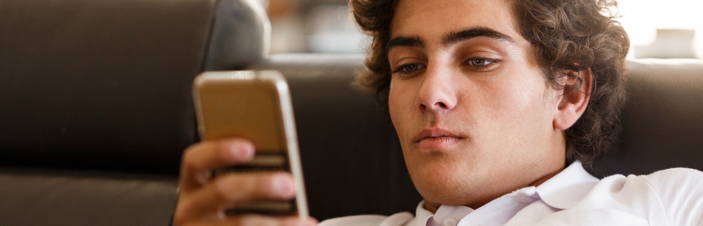 teen boy on cell phone