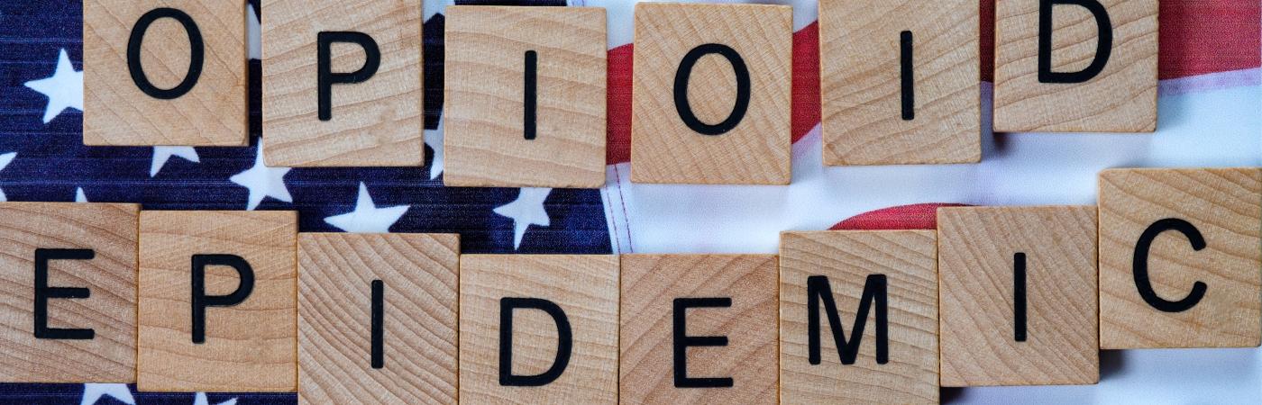 Opioid Epidemic scrable letters on USA flag