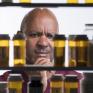 man looking in to medicine cabinet