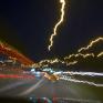 Blurred nighttime road from perspective of a drugged driver