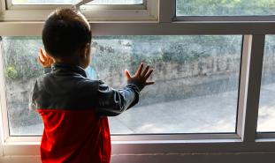 child looking out of window