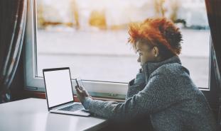 teen girl looking at laptop