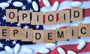 Opioid Epidemic scrable letters on USA flag