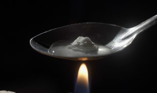 Cooking heroin on spoon