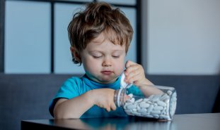 Toddler with pills