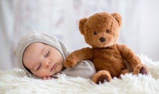 Baby and teddy bear