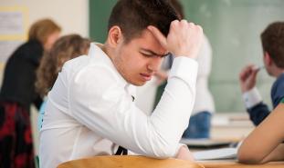 stressed out student at desk