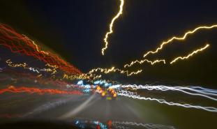 Blurred nighttime road from perspective of a drugged driver