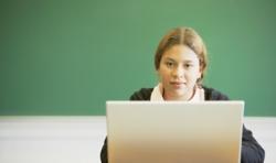 girl with laptop in classroom