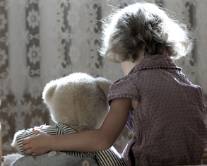 sad girl with teddy bear